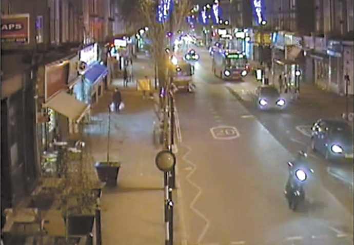 Henry Hicks_CCTV showing the moped in Caledonian Road with a police car behind the bus