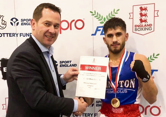 Gold medals are worth the wait Masood receiving his certificate and medal from England Boxing CEO Gethin Jenkins.
