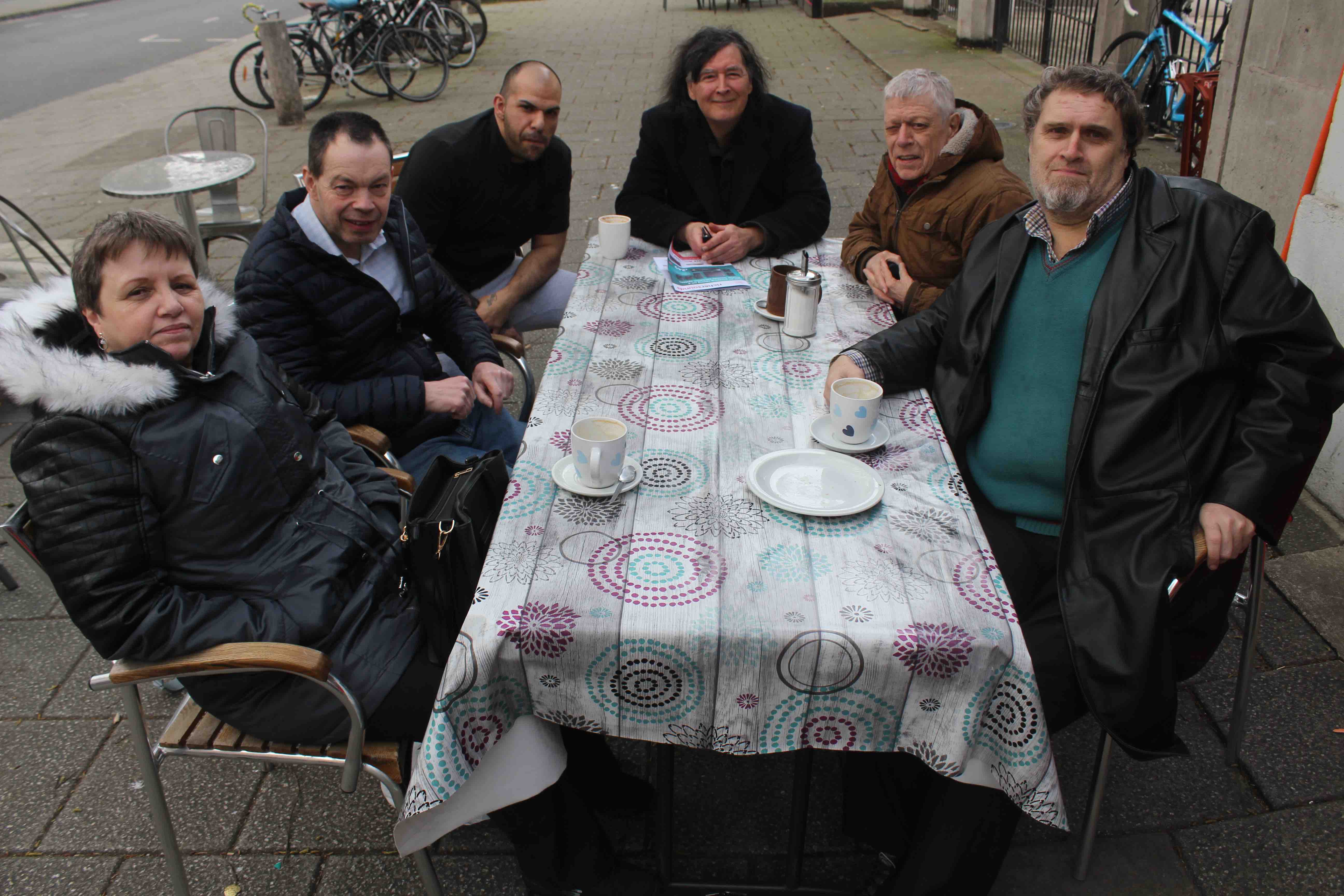 The group of disabled residents who regularly meet up at Pinner Cafe in Chalton Street, from left: Ann Stannard, John Kent, cafe manager Mick Duran, Stephen Denholm, Ken Jones and Michael Royce
