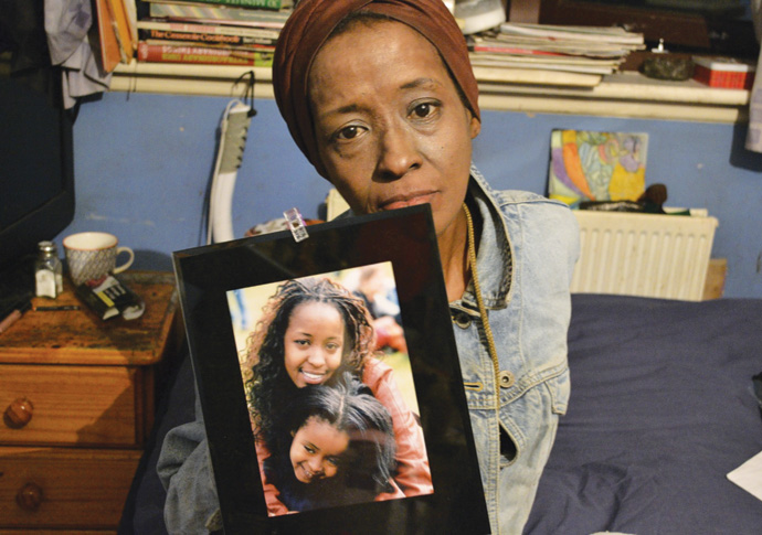 Noreen Mutua with photo of daughter Jade