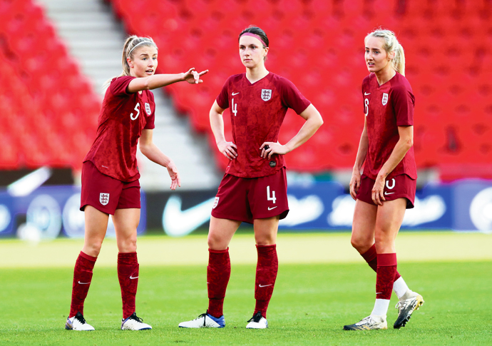 Arsenal defenders Leah Williamson and Lotte Wubben-Moy with Millie Turner. Photo- The FA