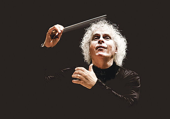 Sir Simon Rattle conducting