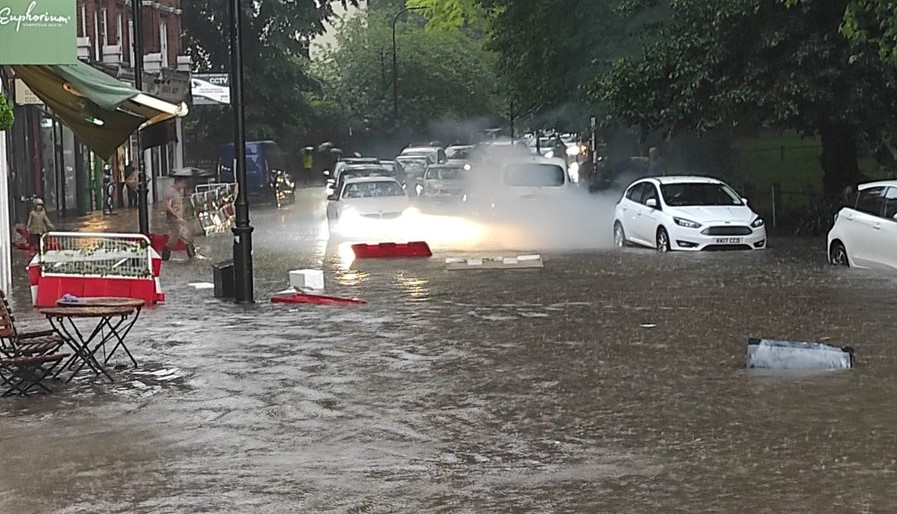 Shops, businesses and streets flooded by torrential rain storm