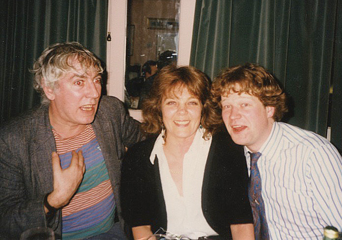 Harrington: Trooping the colourful Hilary Lowinger with Peter Cook and reporter Christopher Sylvester at the Coach and Horses in Soho 1988