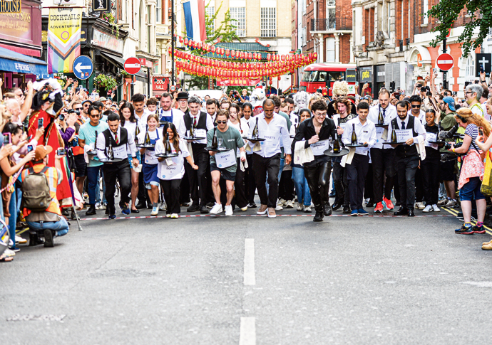 Fun and frolics as Soho village fête reaches milestone Soho Waiters Race And they're off PC