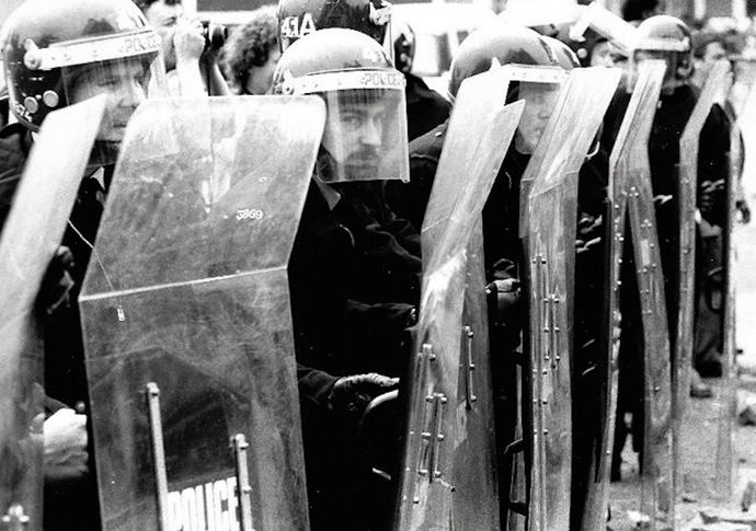 Coal, Corrie and Callaghan: whatever happened to the working class? Police in riot gear at the Battle of Orgreave photo credit West Midlands Police_CC BY-SA 2